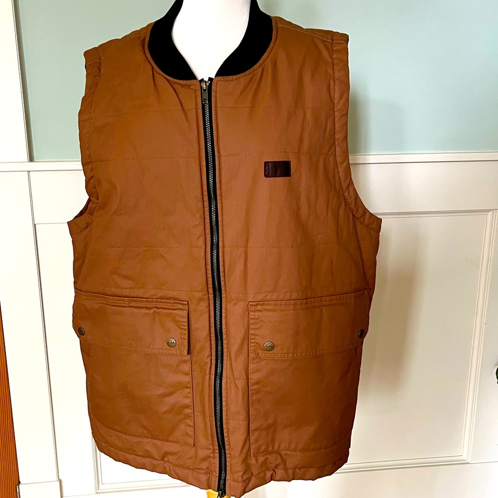 Men’s KAVU utility vest with plaid lining.
